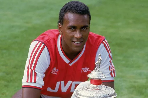 Image of David Rocastle with a cup.